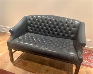 Tufted navy blue leather settee