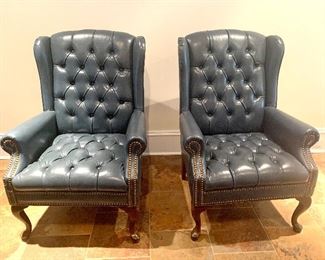 pair of navy blue leather wing back chairs 