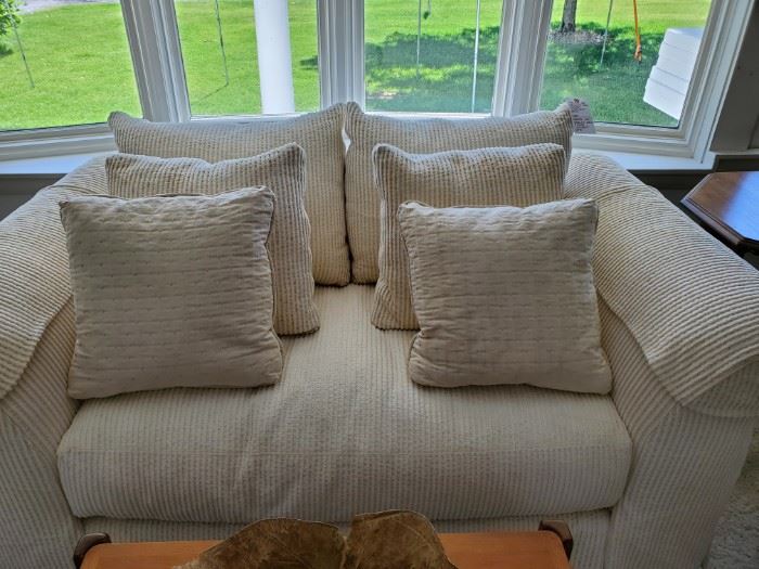 Custom cream love seat/small sofa with pillows