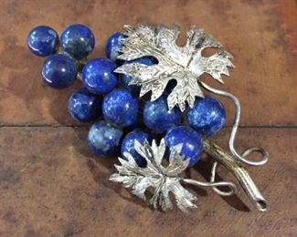 Delicate antique silver brooch featuring lapis lazuli bead "grapes". 1 5/8" x 2 1/8". Unique old twist-tube clasp in perfect working order.  $100
