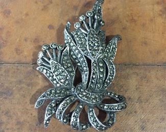 Pretty silver floral brooch completely covered in sparkly marcasite. 1 3/8" x 2 1/4", stamped SILVER on back. $70
