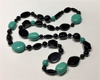Beautiful "endless" (no clasp) 34" long hand-knotted beaded necklace with turquoise, onyx and sterling silver beads.  $100
