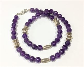 Beautiful 18"  necklace with smooth round amethyst beads and Sterling silver rondelle and oval melon shaped beads.  Sterling clasp.  $120
