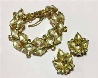 Vintage Juliana rhinestone bracelet and clip earrings set.  Bracelet is 7 1/2" and earrings are 1" x 1 1/4".  Both pieces have gorgeous light yellow round and kite shaped rhinestones.  Bracelet has a safety chain clasp.  Bracelet $145, earrings $95; set is $225.  
