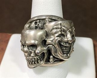 Size 10 1/2 heavy Sterling silver skull ring.   Featuring nine skulls and a few bones too, this is a real conversation piece!  Stamped 925 inside band.  $295
