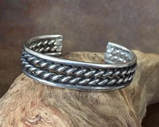 Classic Sterling silver vintage cuff bracelet with twisted cable design.  5 1/8" inner circumference with 1 1/16" gap opening.  Stamped STERLING.  $190 
