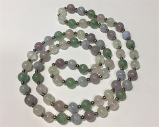 29 1/2"  necklace with 8mm round gemstone beads in lovely pastel shades of lavender, pink, light minty green and grays, all divided by Sterling silver spacer beads.  $90
