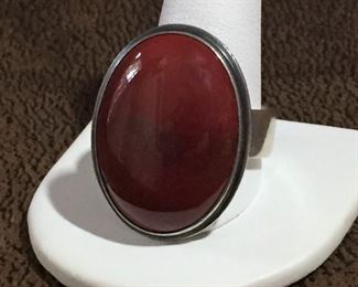 Size 14 men's designer Sterling silver and brick-red colored gemstone ring.  Signed MURPHY and stamped STERLING inside band.  $140
