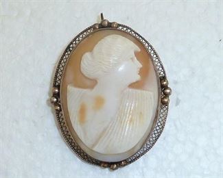 Large lovely vintage cameo. True carved shell with gilded silver filigree surround. 1 5/8" tall. Can be worn as pin or pendant. $119