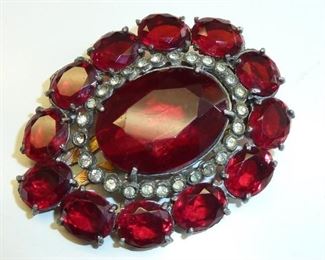 1930's fur clip in luscious vibrant red glass, accented with clear crystals. $99