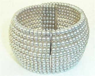 Must have classic back in style again!  Genuine pearls and Sterling silver wrap bracelet.  $249 