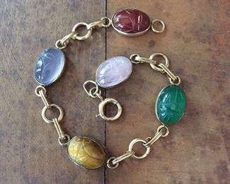 Vintage 12K gold filled bracelet with carved scarab cabochons of carnelian, chalcedony, tiger's eye, green onyx and rose quartz.  7 1/2" long, marked 1-20 12k G.F. on clasp.  $120

