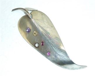 Lovely large 4.5" long sterling silver leaf pin, set with multicolored gems. This is an artist made vintage piece, and is marked STERLING on the back. Beautiful. $198 