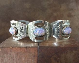 Vintage 50s Mexico sterling silver link bracelet with "dragon's breath" glass cabochons. 6 1/2" long, stamped HECHO EN MEXICO STERLING 925. $160
