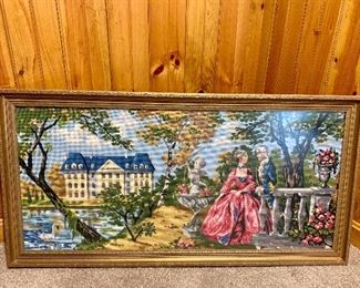 Item 142:  Vintage Framed Cross Stitch feat. Woman in Pink and Yellow House - 23.5" x 45.5": $145