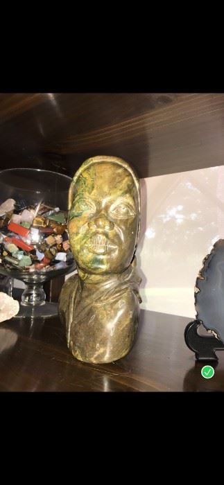With a bright flash you can see the dark green and light green coloring .  You can see the details of the carving . The art capture the beauty of the young women. Brown / Green/ Yellow 	Verdite	Created by an Art from Zambia $450