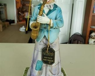 Melody in Motion Hand Painted Bisque Porcelain Clown with Saxophone. Needs AA Batteries