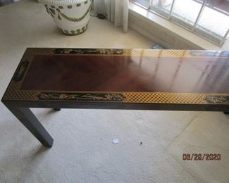 Sofa table with decorative edging. 