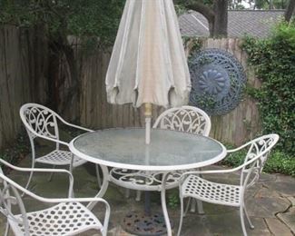 Patio table w/ 4 chairs and umbrella. 
