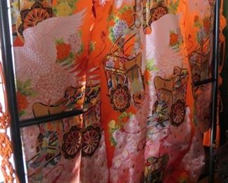 Orange kimono. Also in the sale is a dramatic purple and gold kimono and other kimonos and obis.