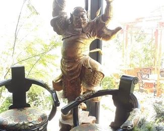 Temple guardian statue is almost lifesize. Bar stools remain with the house which has been sold.