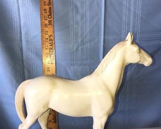 Plastic 15” horse, he has pegs on the bottom of his feet. $15.00