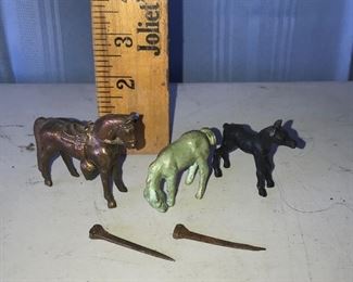 Three metal horses and two old nails $7.00