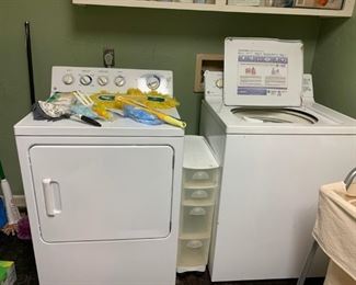 Laundry: Washer and Dryer Pair, Laundry Organizer between, selection of Swiffer dusters.  Two Laundry organizers, and not pictured, closet organizers.  Also an iRobot Roomba.