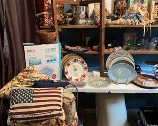 Master Bedroom:  Pillows of all sorts, decorative plates, foot spa, handmade baskets, Cloth and china dolls, colored glassware.  Not pictured more art, quilt rack, coat rack.