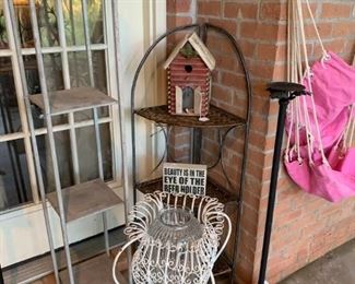 Back Porch: Outdoor shelves, decorative candle stands, decorative metal and glass stand.