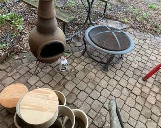 Back Porch: Chiminea and fireplace, plant tiles.  Barely in photo bottom right is a neat reclining outdoor chair, some garden edging and other neat metal garden items.