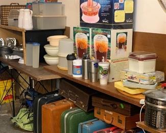 Garage: Cake pans, Tupperware, drink dispensers, lunch trays, vintage suitcases and briefcases.  Not pictured is more cookware, tools, chairs, pet supplies, paint in cans.