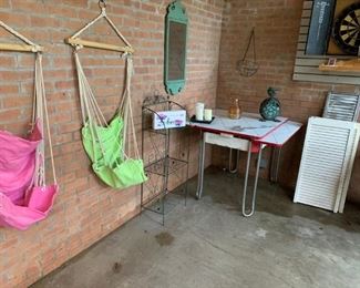 Back Porch:  Metal kitchen table, outdoor decorations, some louver doors, and a dart board.  The swings are sold.  Not pictured are some old windows from a 1906 Little Rock home.