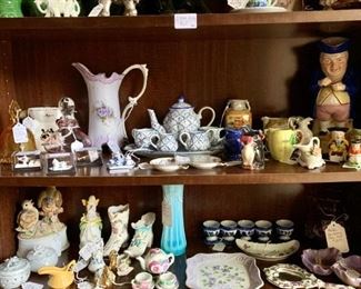 Just inside the front door.  Book shelves full of every imaginable figurine, tea cups and pots, pitchers, elephants, bunnies, and birds,... too many to list.  