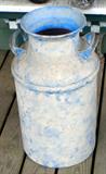 Painted milk can.