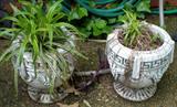 Pair of small old concrete flower pots