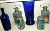 Assortment of bric-a-brac including cobalt bottles.