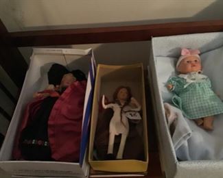 There are several dolls in this estate sale from composite, plastic, felt and bisque
