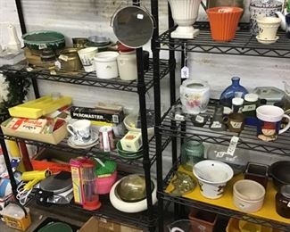 The shelves have vintage bowls, cabinets organizers, baskets and lawn games