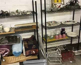More shelves in the basement with more vintage finds from tins, platters, ironing board for sleeves and bowls