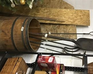 The wooden barrel is full of antique coal room tools