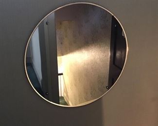 A vintage round mirror