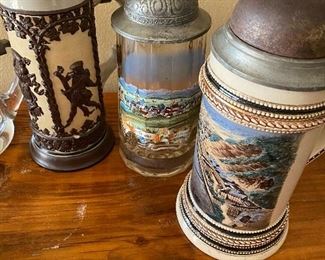 To the Left: Antique Mettlach Beer Stein Late 1800's. Middle Stein Souvenir German Town. Right: Hand Painted Bell on Top Stein..more beer please!!