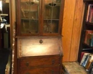 $395 English drop front secretary oak and stained glass window doors.