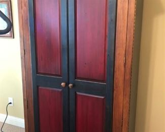 $300 - Shakero-style red/black/pine armoire/wardrobe/TV cabinet; measures 24" deep, 40" wide, 74" tall.