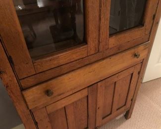 $300 - Close-up view of antique glass-door pine pie safe; measures 14" deep, 32" wide, 70.5" tall.