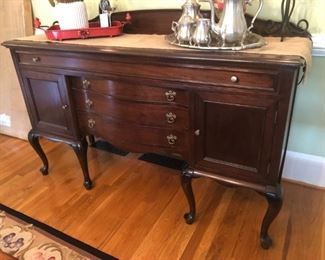 $575 - Fabulous vintage mahogany sideboard with great storage; measures 23" deep, 66" wide, 44" tall. Brass hardware. Also great if painted!