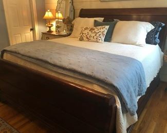 $650 - Henredon mahogany king sleigh bed (does not include mattresses or linens); measures 94" deep, 82" wide, 60" tall.