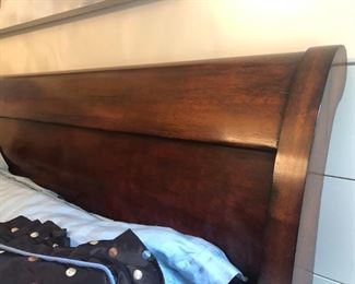 $650 - Close-up view of Henredon mahogany king sleigh bed headboard (does not include mattresses or linens); measures 94" deep, 82" wide, 60" tall.