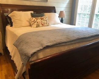 $650 - Henredon mahogany king sleigh bed (does not include mattresses or linens); measures 94" deep, 82" wide, 60" tall.